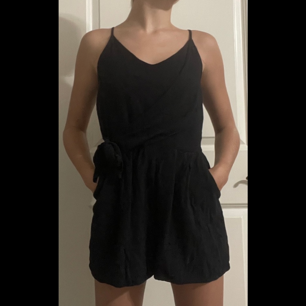 Black spaghetti strap romper with cross over tie in the front